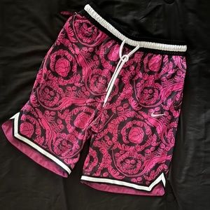 Pink and black Nike basketball shorts